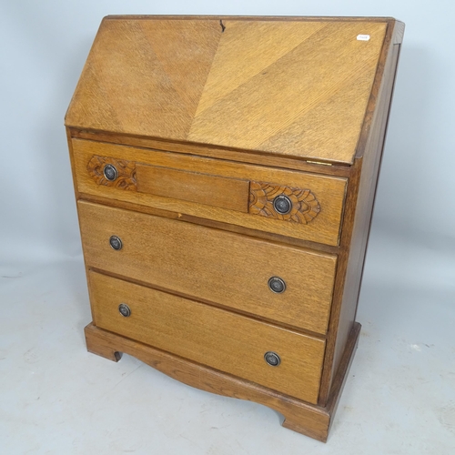 2547 - A reproduction oak bureau, the fall-front revealing a fitted interior, with 3 long drawers under, on... 