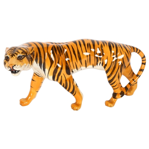 112 - BESWICK - a study of a prowling tiger, length 22cm, model 1486