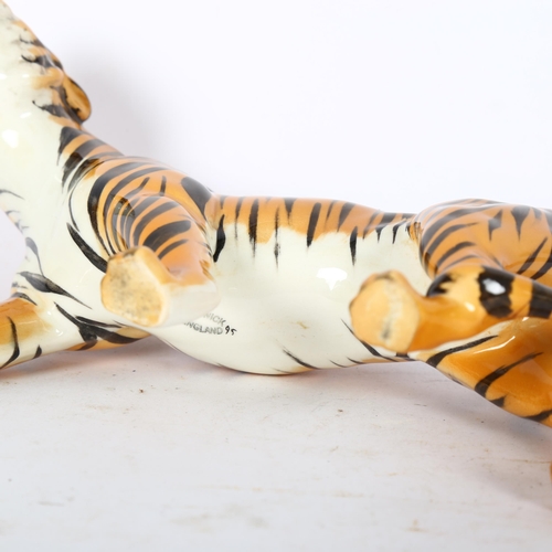 112 - BESWICK - a study of a prowling tiger, length 22cm, model 1486