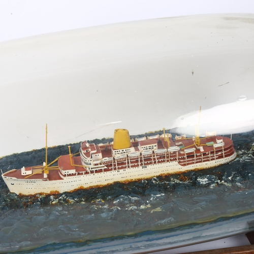 13 - A mid-century scratch-built model of the SS Iberia presented in a tolly bottle, (this was the flag s... 