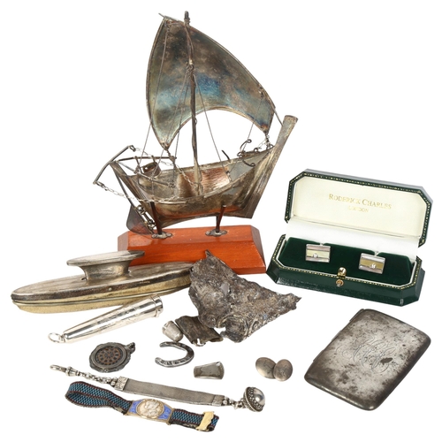 139 - A group of silver and other items, including a 925 silver yacht, silver-handled nail buffer, cufflin... 