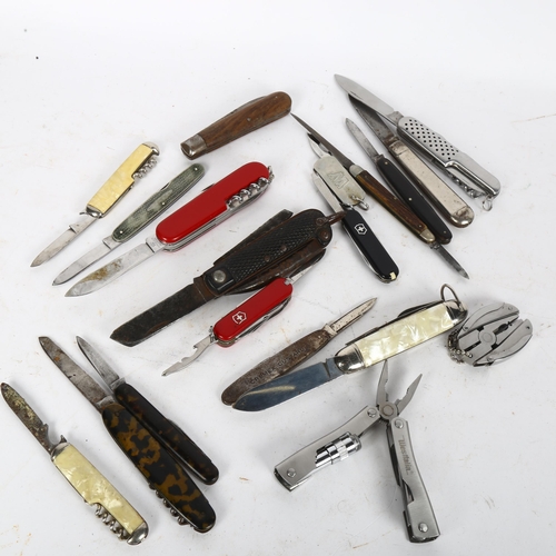 143 - A group of various penknives, including Swiss Army, etc
