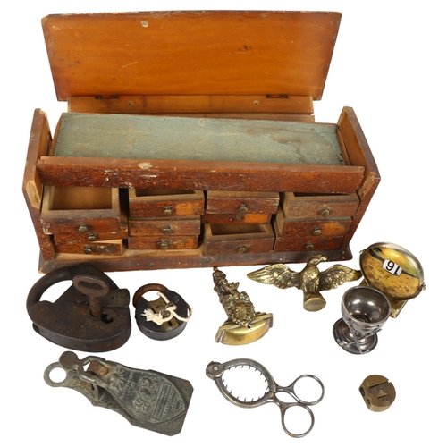 150 - A group of various items, to include a Victorian egg top opener, padlock and key, letter clip, minia... 