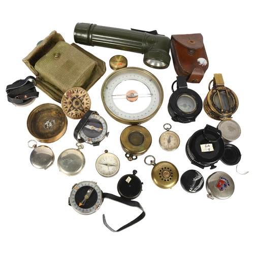 151 - A group of Vintage military and other compasses, including the Magnapole, and a 1942 brass compass b... 