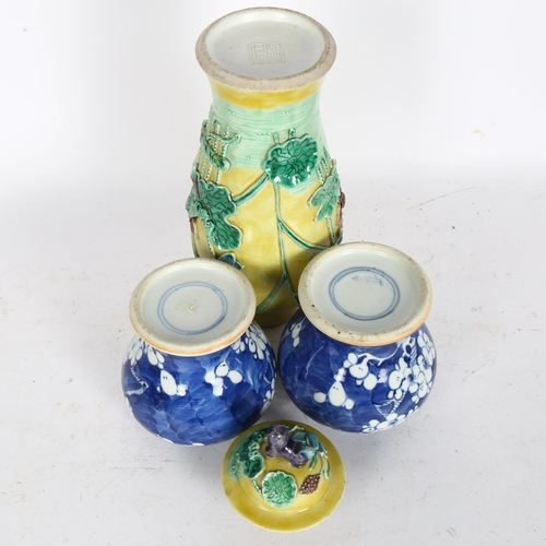 159 - A pair of Antique Chinese blue and white vases with prunus decoration, height 11cm, and a yellow gro... 