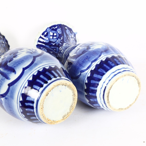 166 - A pair of Chinese blue and white porcelain vases with frilled rims, height 44cm