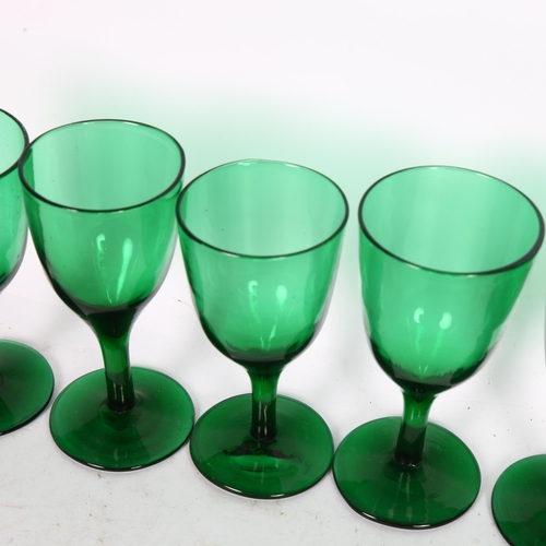 192 - A set of 7 early 20th century Bristol green glasses, height 12cm