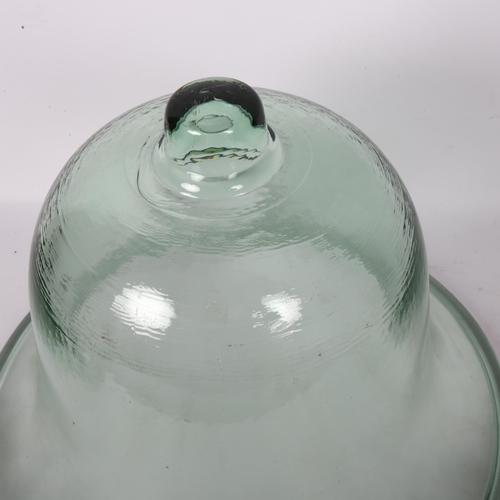 20 - A large green glass bell-shape cloche, height 29cm
