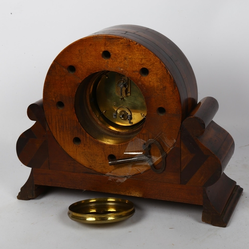 21 - An 8-day mantel clock framed from the central hub of an early aeroplane propeller, on a mahogany pli... 