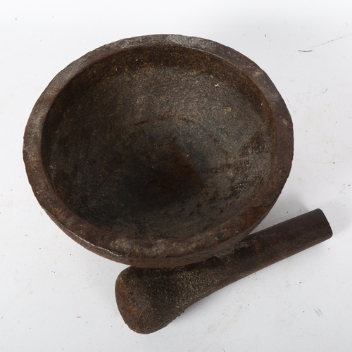 43 - A cast-iron shot grinding pestle and mortar, bowl diameter 20cm, height 10cm