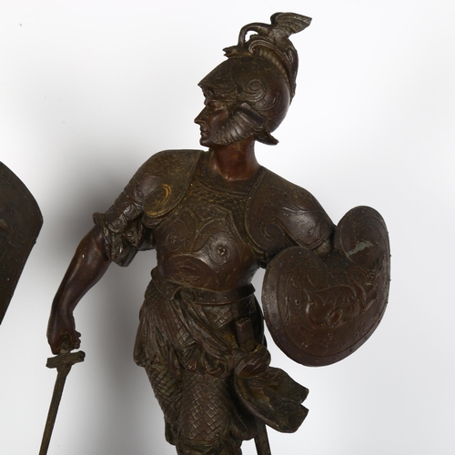 53 - A pair of patinated spelter Middle Eastern warrior figures, on shaped plinth bases and wooden stands... 