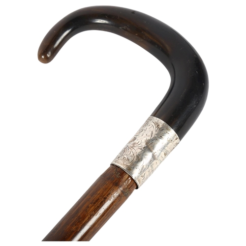 66 - An early 20th century horn-handled cane, with presentation silver collar, 