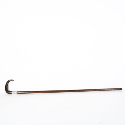 66 - An early 20th century horn-handled cane, with presentation silver collar, 