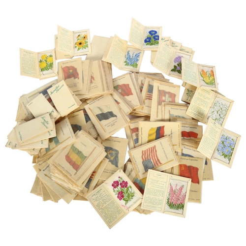 91 - A large collection of Kensitas cigarette silks, flags and flowers