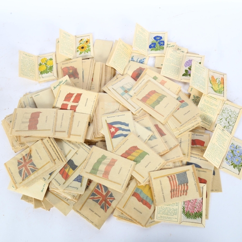 91 - A large collection of Kensitas cigarette silks, flags and flowers