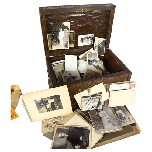 96 - A large collection of Vintage family and other photographs and postcards