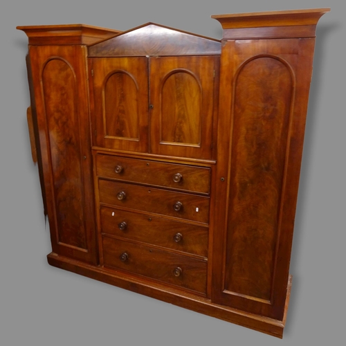 2592 - A 19th century mahogany sentry box compactum wardrobe in 7 sections, consisting of a centre section ... 