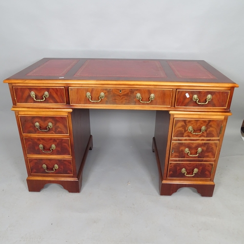 2532 - A late 20th century Waring and Gillow mahogany pedestal writing desk with inset red leather skiver a... 