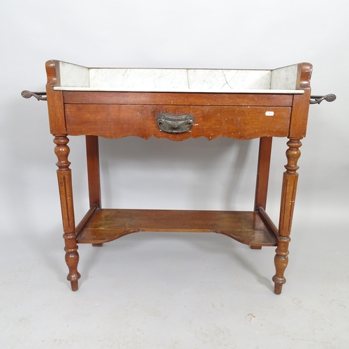 2537 - A Victorian mahogany two-tier marble topped washstand with raised back and carved fluted legs. 98cm ... 