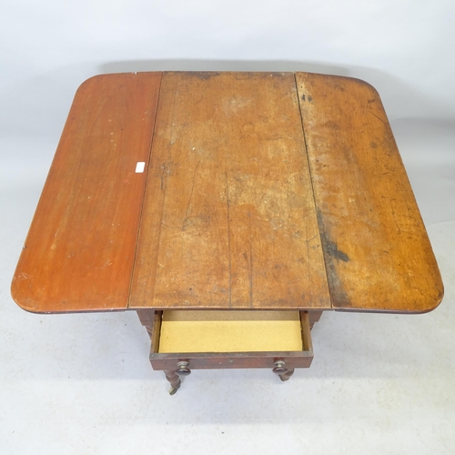 2545 - A 19th century mahogany pembroke table with end frieze drawer, raised on turned legs. 89cm x 71cm x ... 