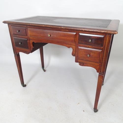 2546 - A reproduction mahogany lowboy desk with five fitted drawers, raised on square tapered legs. 91cm x ... 