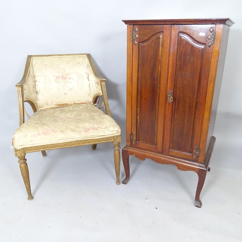 2549 - An Arts and Crafts style mahogany music cabinet, with shelf-fitted interior on cabriole legs, 52 x 1... 