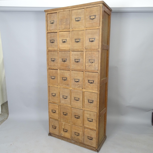 2559 - A Vintage oak bank of 28 drawers, 78cm x 179cm x 35cm