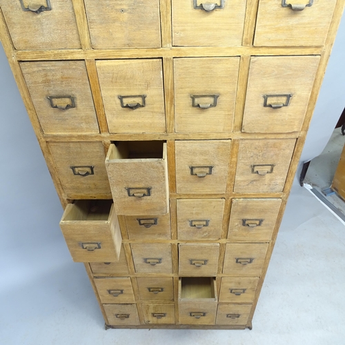 2559 - A Vintage oak bank of 28 drawers, 78cm x 179cm x 35cm