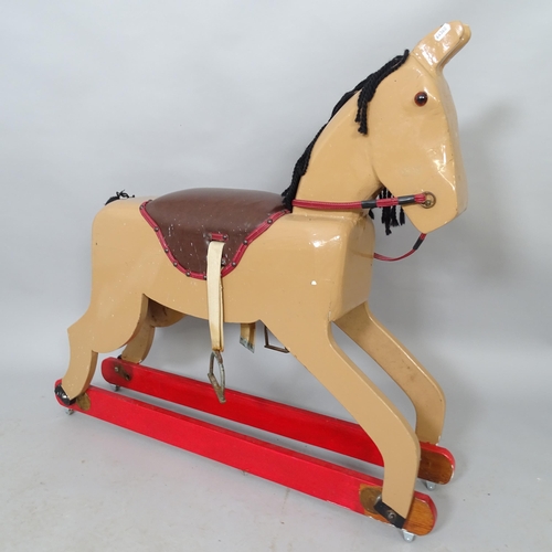 2560 - A painted wooden rocking horse. L 100cm