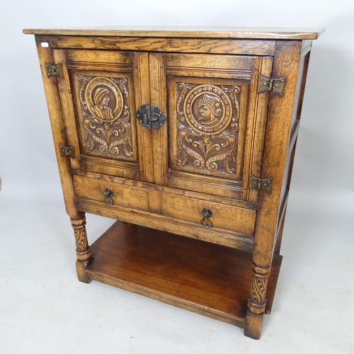 2570 - A carved oak hall cabinet with single drawer and shelf under. 84cm x 99cm x 46cm, possibly by Titchm... 