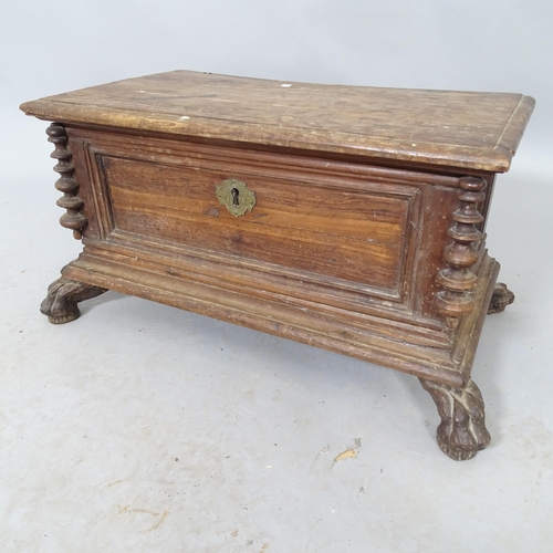 2575 - A vintage stained pine box with lifting lid raised on lion-paw feet. 53cm x 29cm x 29cm