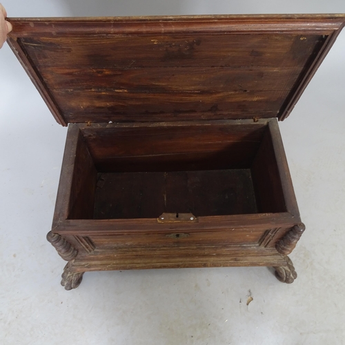 2575 - A vintage stained pine box with lifting lid raised on lion-paw feet. 53cm x 29cm x 29cm