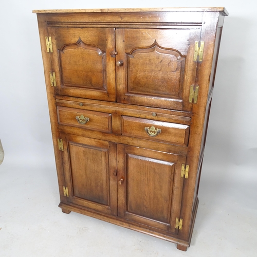 2576 - A Titchmarsh & Goodwin Ipswich oak  oak four-door housemaid's cabinet with two fitted drawers, brush... 