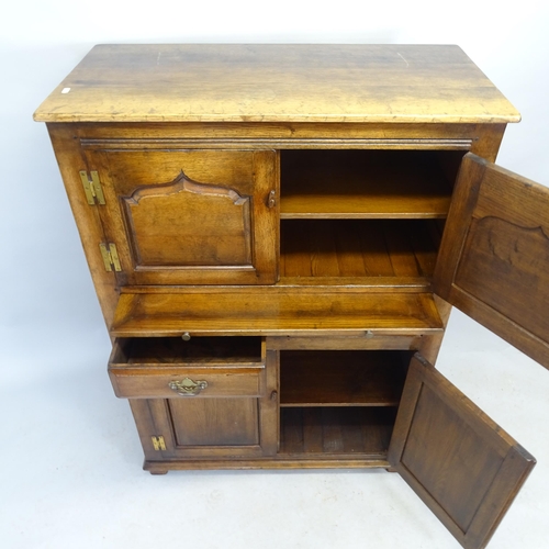 2576 - A Titchmarsh & Goodwin Ipswich oak  oak four-door housemaid's cabinet with two fitted drawers, brush... 