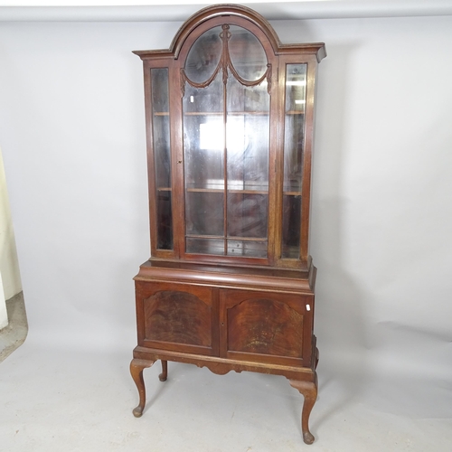 2582 - A Victorian mahogany two-section dome-top book case, with cupboards under. 88 x 186 x 40cm