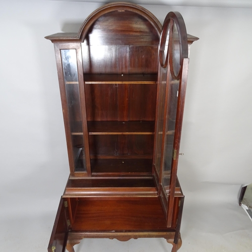 2582 - A Victorian mahogany two-section dome-top book case, with cupboards under. 88 x 186 x 40cm