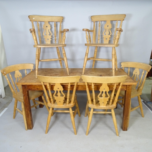 2585 - A vintage stained pine farmhouse dining table, 156cm x 76cm x 79cm and a set of six pine dining chai... 