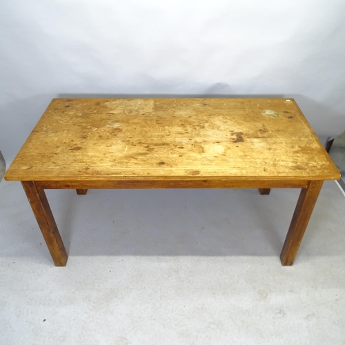 2585 - A vintage stained pine farmhouse dining table, 156cm x 76cm x 79cm and a set of six pine dining chai... 