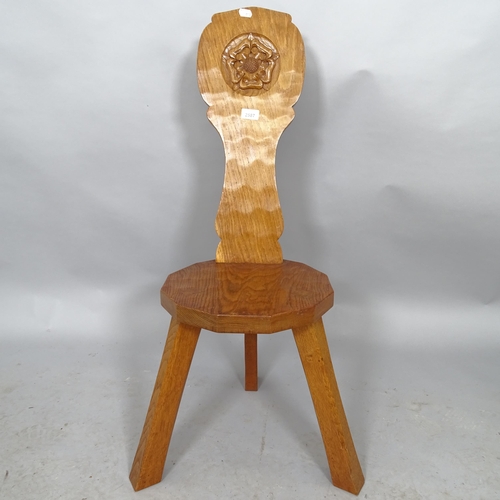 2587 - An oak spinning stool by Thomas Gnomeman Whittaker with carved yorkshire rose decoration and carved ... 