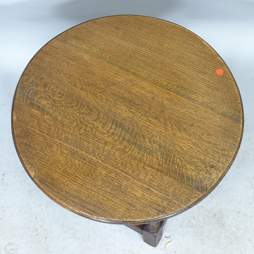 2590 - A circular joined oak lamp/occasional table. 61cm x 48cm, and another mahogany rectangular low coffe... 