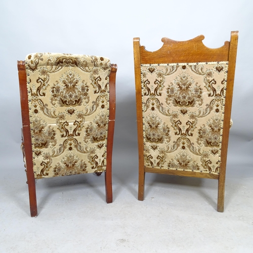 2591 - A his and hers pair of Arts and Crafts oak and upholstered lounge chairs