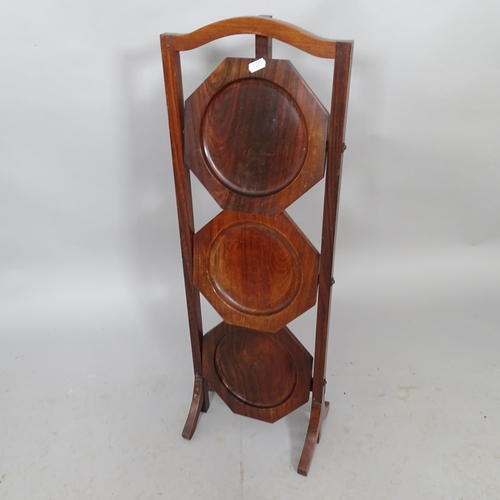 2598 - A mahogany three tier folding cake stand, height 80cm