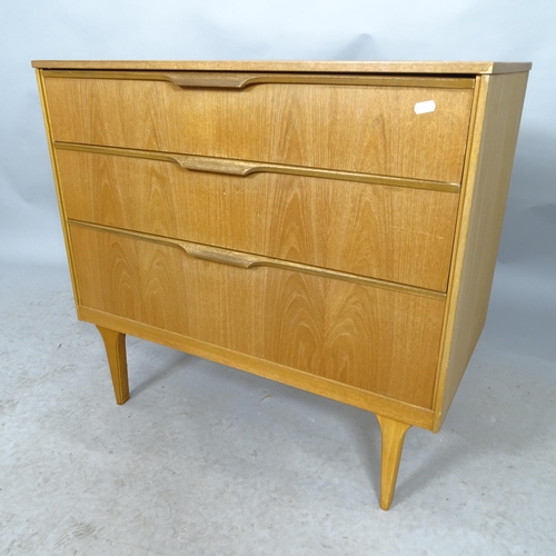 2605 - A mid-century teak chest of three long drawers. With label for Austinsuite. 80cm x 74cm x 43cm