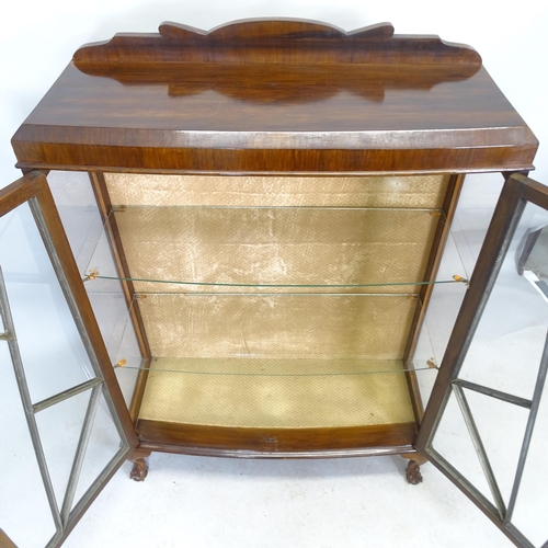 2609 - A 1930s mahogany display cabinet with raised back, two glazed and panelled doors, two fixed shelves ... 