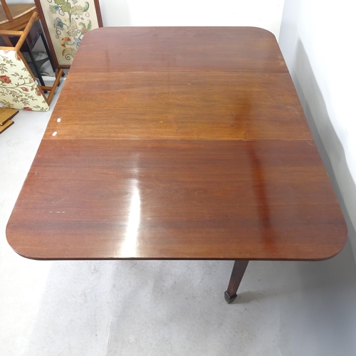 2611 - A 19th century mahogany drop-leaf dining table, raised on square tapered legs with spade feet. 55cm ... 