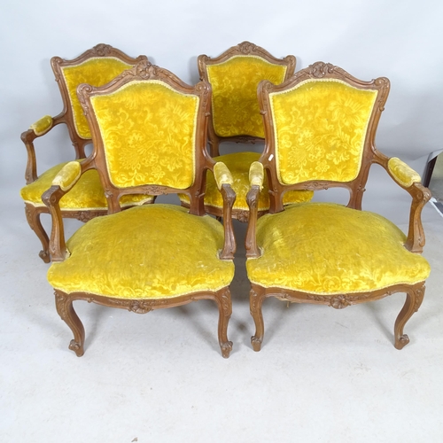 2612 - A set of four French  oak and upholstered parlour armchairs.