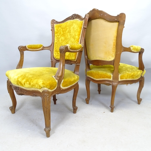 2612 - A set of four French  oak and upholstered parlour armchairs.