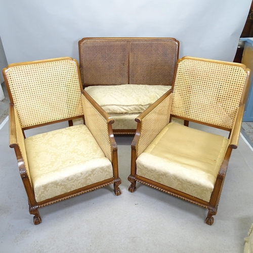 2614 - A 1920s Bergere three piece suite comprising a two-seater settee, 118cm x 90cm x 84cm, and two match... 