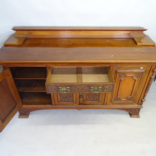 2629 - An Art Nouveau sideboard with raised back, two fitted drawers and four panelled doors with applied c... 