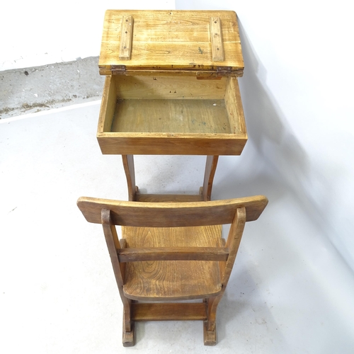 2634 - A vintage elm and pine school desk. 88cm x 82cm x 56cm